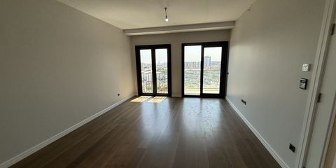 An empty living room with wooden floors, ready to be let